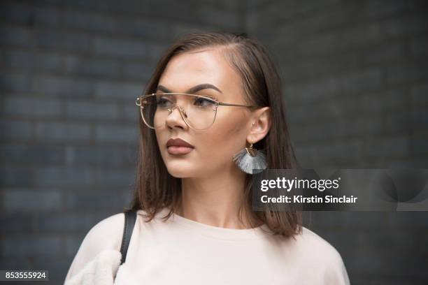 Fashion blogger Klaudia Wieteska wears a Zara top, Muse Me glasses on day 1 of London Womens Fashion Week Spring/Summer 2018, on September 15, 2017...