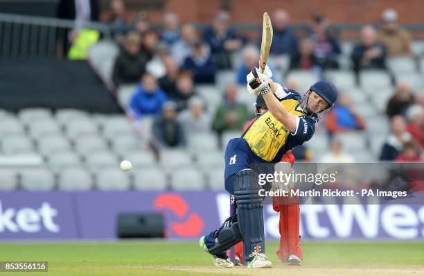 Birmingham Bears' Will Porterfield hits for 4 from the bowling of Lancashire's Steven Croft, during the Natwest T20 Blast match at Old Trafford,...