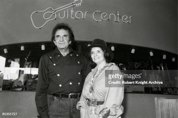 Photo of June CARTER and Johnny CASH, Johnny Cash and wife June Carter Cash at the Guitar Center