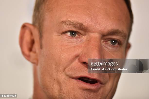 Former South African rugby international Francois Pienaar takes part in a press conference after South Africa presented their bid to host the 2023...