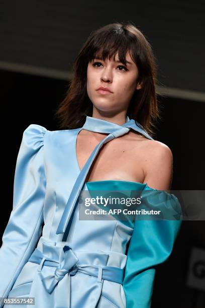 Model presents a creation for fashion house Daizy Shely during the Women's Spring/Summer 2018 fashion shows in Milan, on September 25, 2017. / AFP...