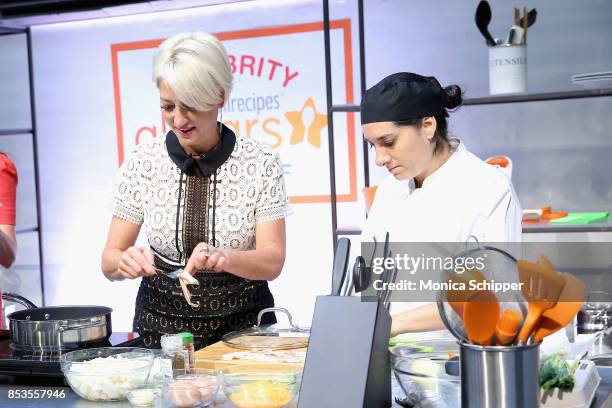 Dorinda Medley and a chef attend the Meredith Corporations Second Annual BrandFront Presentation at Cedar Lake on September 25, 2017 in New York City.