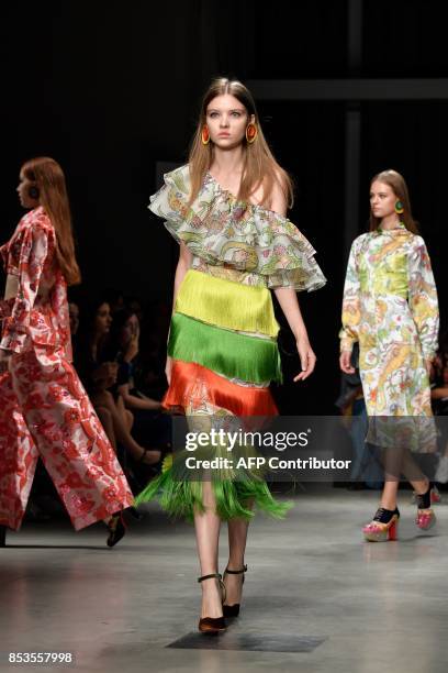 Model presents a creation for fashion house Daizy Shely during the Women's Spring/Summer 2018 fashion shows in Milan, on September 25, 2017. / AFP...