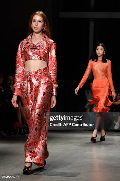 Model presents a creation for fashion house Daizy Shely during the Women's Spring/Summer 2018 fashion shows in Milan, on September 25, 2017. / AFP...