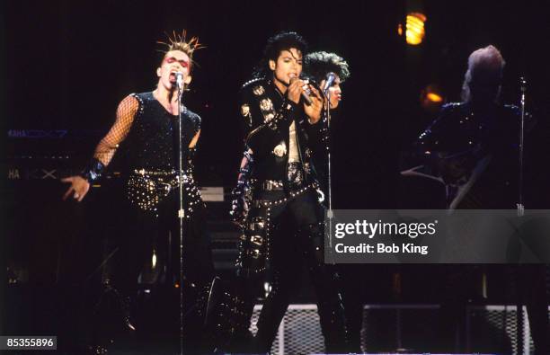 Photo of Michael JACKSON; Michael Jackson performing on stage, with backing singers, at the Paramatta Stadium in Sydney - Bad Tour