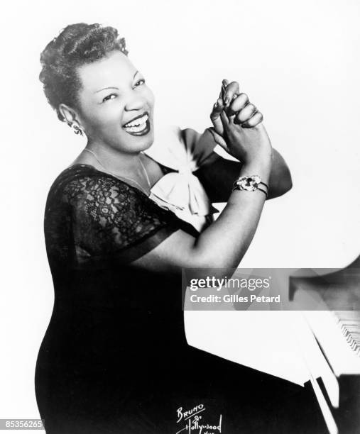 Photo of Rose MURPHY; Posed studio portrait of Rose Murphy, with piano