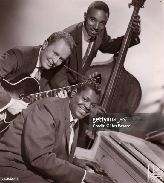 Photo of Ray BROWN and Herb ELLIS and Oscar PETERSON; Oscar Peterson Trio with Herb Ellis and Ray Brown circa 1955, group portrait