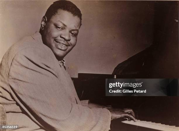 Photo of Oscar PETERSON; Portrait of Oscar Peterson, at the piano circa 1955