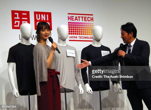 Actress Nozomi Sasaki and Fast Retailing Group Executive Vice President Yoshihiro Kunii attend an Uniqlo Heattech press conference on September 25,...