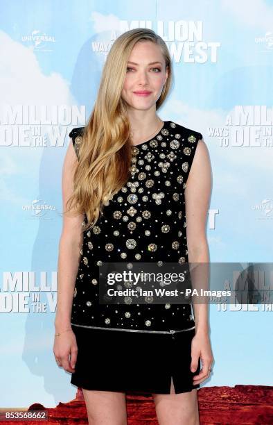 Amanda Seyfried attending a photocall for the film A Million Ways to Die in the West at Claridge's Hotel in London.