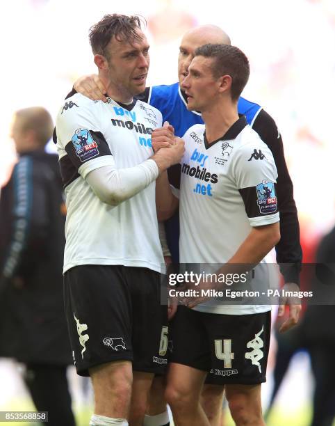 Derby County's Richard Keogh is consoled by Craig Bryson