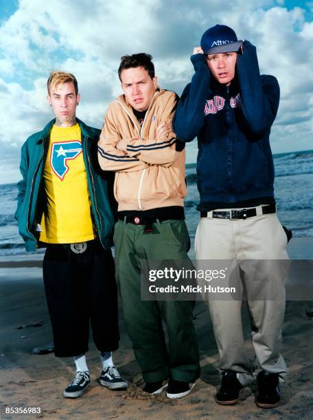 Photo of BLINK 182 and Travis BARKER and Tom DELONGE and Mark HOPPUS; Posed group full length portrait L-R Travis Barker, Tom DeLonge and Mark...