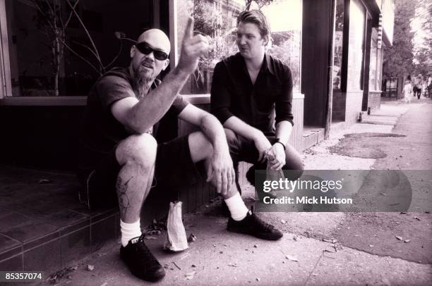 Photo of QUEENS OF THE STONE AGE and Josh HOMME and Nick OLIVERI; Posed portrait of Nick Oliveri and Josh Homme in the street, 398