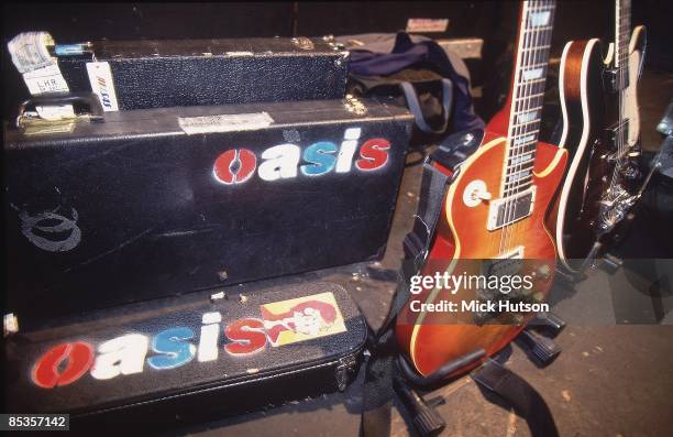 Photo of OASIS and Noel GALLAGHER; Noel Gallagher's guitars and guitar cases backstage