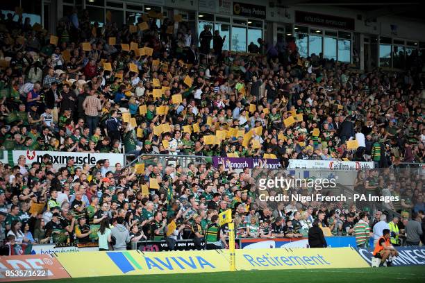 Northampton Saints fans hold up signs which read 'Come On You Saints'