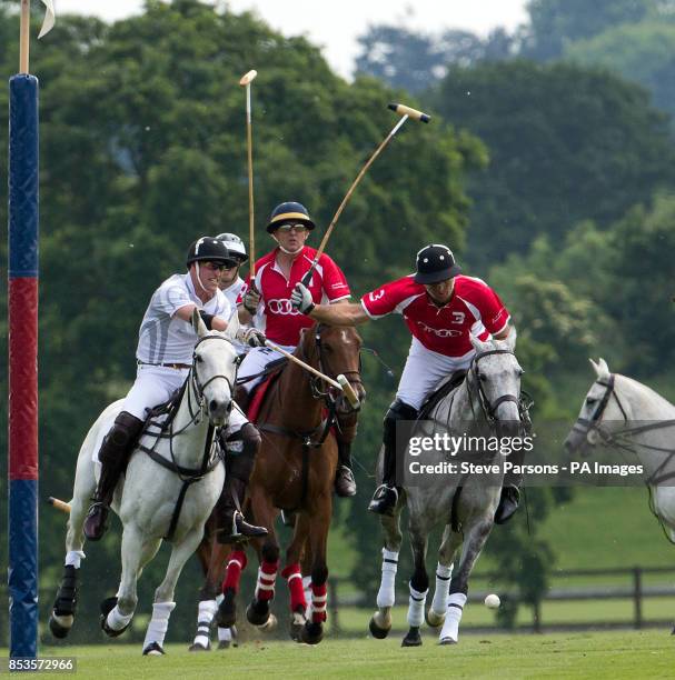 The Duke of Cambridge plays in a charity polo match during the second day of the Audi Polo Challenge at Coworth Park near Ascot, Berkshire.