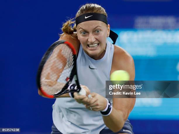 Petra Kvitova of Czech Republic returns a shot to Peng Shuai of China in round 1 during Day 2 of 2017 Wuhan Open on September 25, 2017 in Wuhan,...