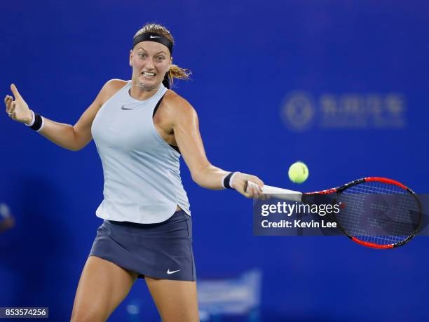 Petra Kvitova of Czech Republic returns a shot to Peng Shuai of China in round 1 during Day 2 of 2017 Wuhan Open on September 25, 2017 in Wuhan,...