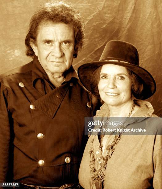 Photo of June CARTER and Johnny CASH; Posed portrait of Johnny Cash with his wife June Carter Cash at his induction to RockWalk