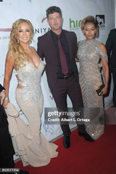 Founder Deborah Alessi, singer Robin Thicke and singer Mel B arrive for the Face Forward 8th Annual Gala held at Taglyan Cultural Complex on...