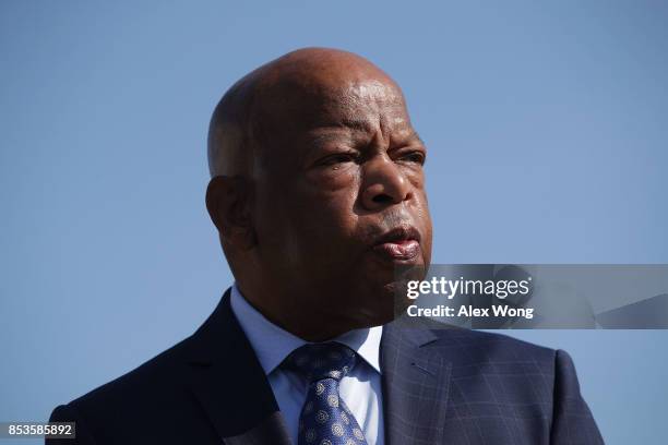 Rep. John Lewis listens during a news conference September 25, 2017 on Capitol Hill in Washington, DC. Reps Lewis was joined by Demetrius Nash, who...