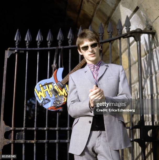 Photo of JAM and Paul WELLER and STYLE COUNCIL; posed, with Rickenbacker guitar hanging on railing behind