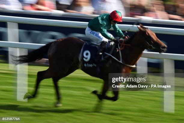 Almargo ridden by Silvestre De Sousa wins The Investec Asset Management Handicap during Investec Ladies Day at Epsom Downs Racecourse, Surrey.