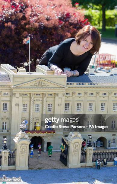 Royal Warrant of Appointment to Her Majesty The Queen Milliner Rachel Trevor Morgan puts the finishing touches to Legoland Windsor Resort's 10cm...