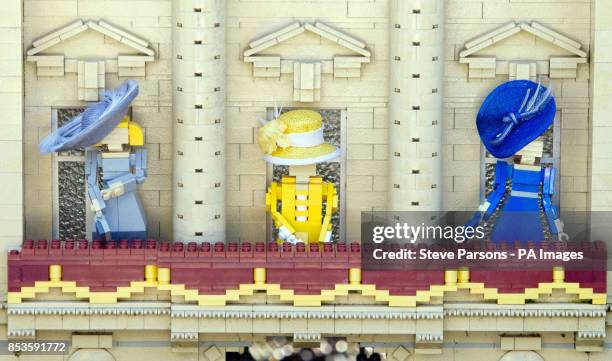 Royal Warrant of Appointment to Her Majesty The Queen Milliner Rachel Trevor Morgan puts the finishing touches to Legoland Windsor Resort's 10cm...