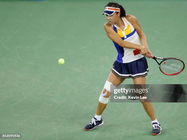 Peng Shuai of China returns a shot to Petra Kvitova of Czech Republic in round 1 during Day 2 of 2017 Wuhan Open on September 25, 2017 in Wuhan,...