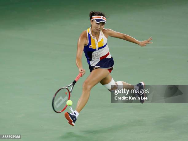 Peng Shuai of China returns a shot to Petra Kvitova of Czech Republic in round 1 during Day 2 of 2017 Wuhan Open on September 25, 2017 in Wuhan,...