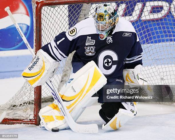 Timo Pielmeier of the Shawinigan Cataractes stops the puck during the game against the Quebec Remparts at Colisee Pepsi on March 06, 2009 in Quebec...