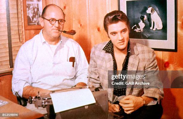 Photo of Colonel Tom PARKER and Elvis PRESLEY, with manager Colonel Tom Parker - posed, c.1956/1967