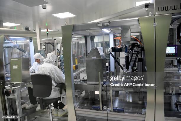 Employees are at work at Allergan's R&D and global production site, on September 25, 2017 in Pringy. Allergan is a global pharmaceutical company...