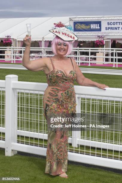 Racegoer Maggie Anderson arrives during Stobo Castle Ladies Day at Musselburgh Racecourse, East Lothian.