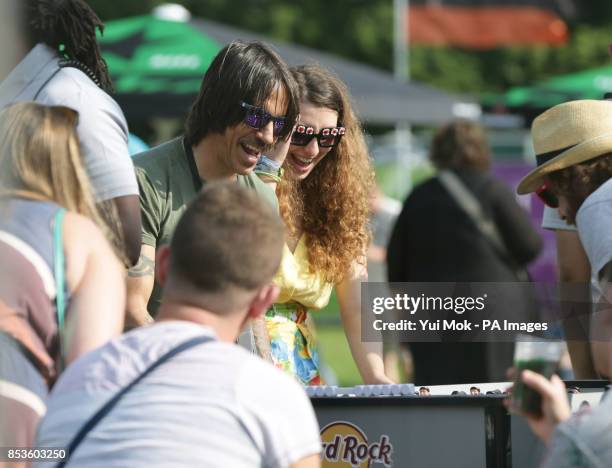 Anthony Kiedis of the Red Hot Chili Peppers playing table football backstage at the Isle of Wight Festival, in Seaclose Park, Newport, Isle of Wight.