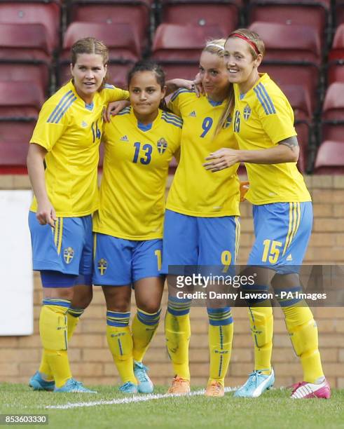 Sweden's Kosovare Asllan celebrates her goal with team mates Hanna Folkesson Malin Diaz Pettersson and Therese Sjogran goal during the FIFA Women's...