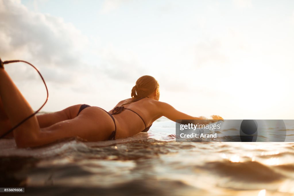 Young surfer woman