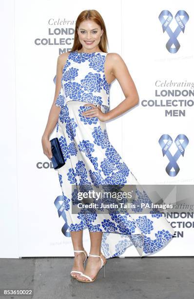 Margot Robbie arrives at One For The Boys charity fashion ball in London.