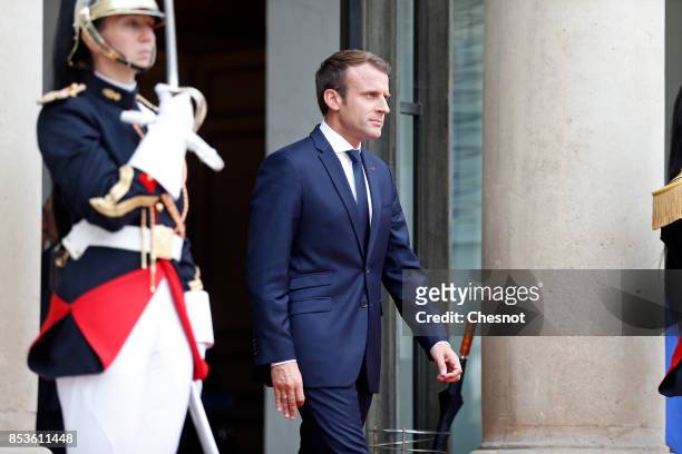 French President Emmanuel Macron walks on the steps of the Elysee Presidential Palace prior to his meeting with Libanese President Michel Aoun on...
