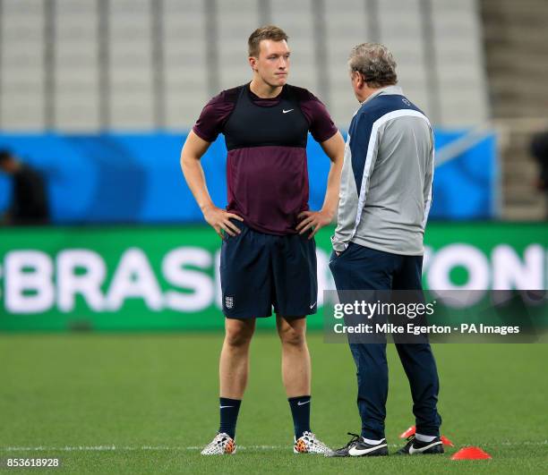 England manager Roy Hodgson and Phil Jones during a training session at the Estadio do Sao Paulo, Sao Paulo, Brazil.