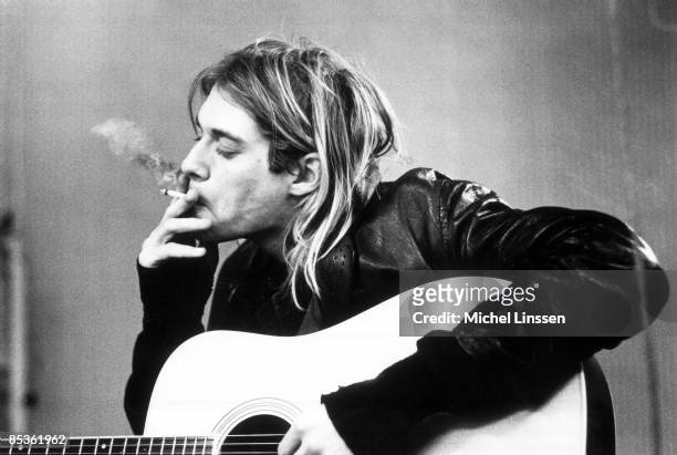 Photo of Kurt COBAIN and NIRVANA, Kurt Cobain recording in Hilversum Studios smoking cigarette