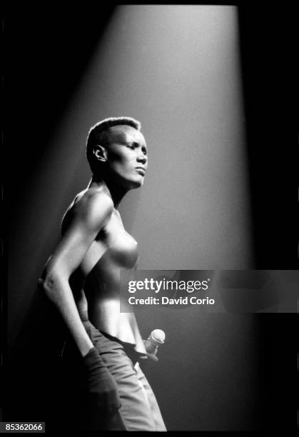 Grace Jones performs at Drury Lane Theatre, London on 10th October 1981. She is wearing a breastplate designed by Issey Mikyake.