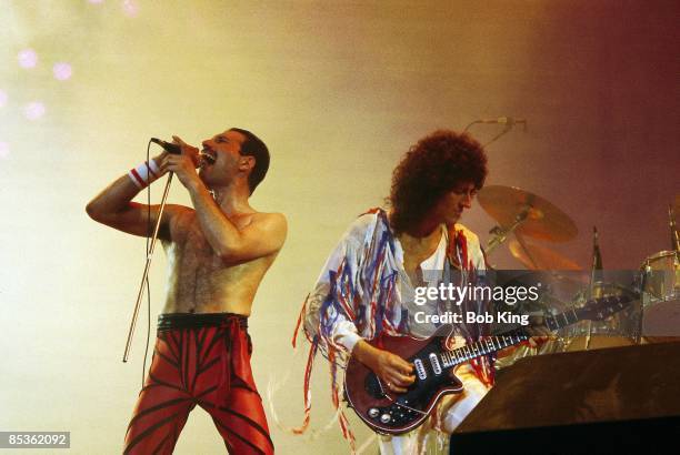 Photo of Brian MAY and Freddie MERCURY and QUEEN; Freddie Mercury and Brian May performing live on stage