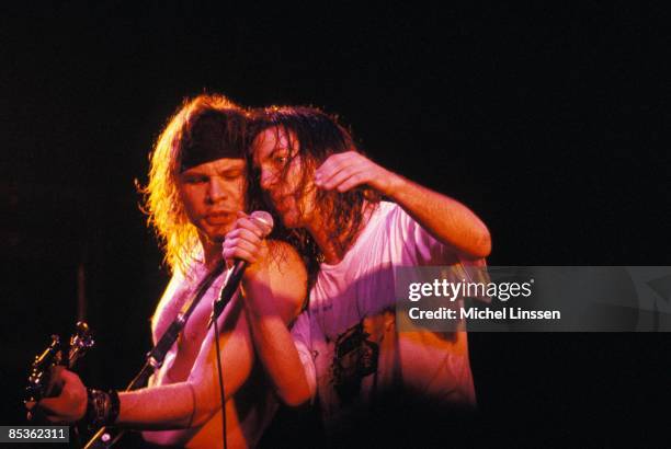 Photo of PEARL JAM and Eddie VEDDER and Jeff AMENT; Jeff Ament and Eddie Vedder performing live onstage