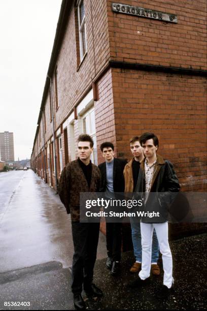 Photo of Andy ROURKE and Johnny MARR and Mike JOYCE and MORRISSEY and The Smiths; L-R: Morrissey, Mike Joyce, Andy Rourke, Johnny Marr - posed, group...