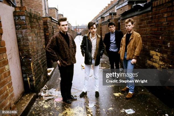 Photo of The Smiths and Andy ROURKE and Johnny MARR and Mike JOYCE and MORRISSEY; L-R: Morrissey, Johnny Marr, Mike Joyce, Andy Rourke - posed, group...