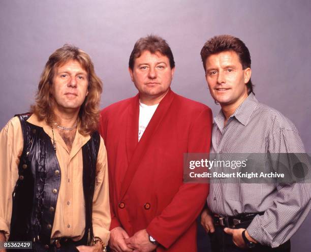 Photo of Greg LAKE and EMERSON LAKE & PALMER and Carl PALMER and Keith EMERSON; L-R: Keith Emerson, Greg Lake, Carl Palmer - posed, group shot at...