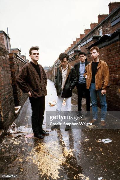 Photo of The Smiths and MORRISSEY and Mike JOYCE and Johnny MARR and Andy ROURKE; L-R: Morrissey, Johnny Marr, Mike Joyce, Andy Rourke - posed, group...