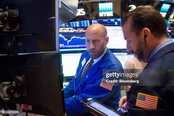 Traders work on the floor of the New York Stock Exchange in New York, U.S., on Monday, Sept. 25, 2017. U.S. Stocks tanked and bonds gained as North...